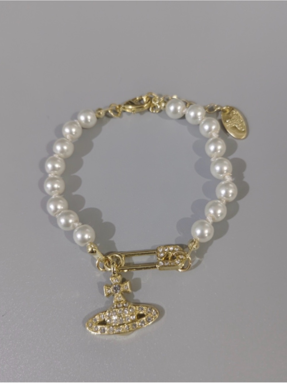 Vivienne Westwood Gold and White Pearl Orb Charm Bracelet